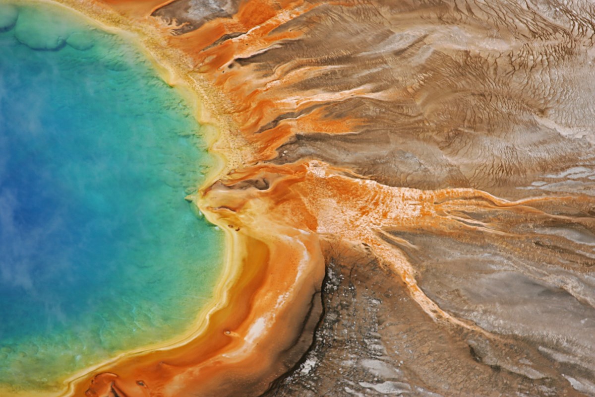 The vivid blue, green and orange waters of Grand Prismatic Spring in Yellowstone National Park